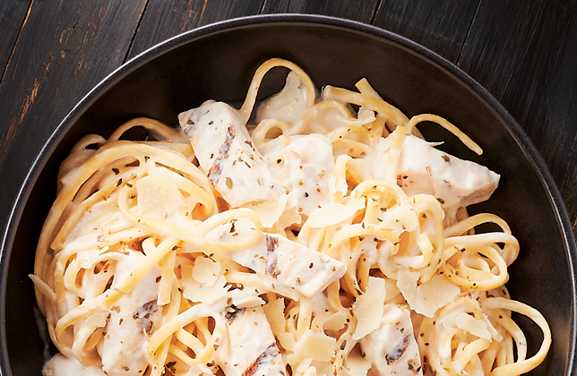 Chicken Alfredo pasta topped with mozzarella