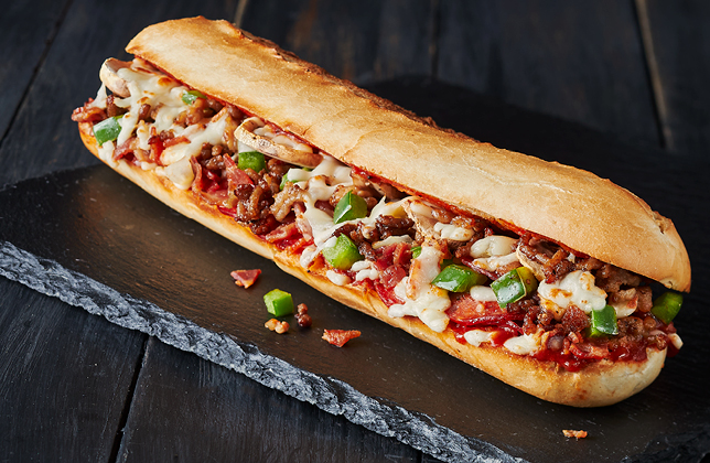 The Works sandwich with pepperoni, salami, bacon, beef, vegetables, pizza sauce and mozzarella