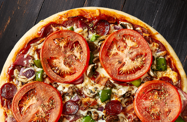 Broadway Classic pizza with pepperoni, ham, sausage, bacon, vegetables and mozzarella
