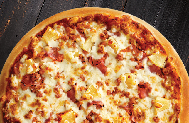 Hawaiian Delight pizza with pineapple, ham, bacon and extra mozzarella