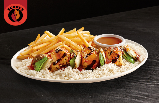 Thai chicken brochettes with sweet spicy Thai sauce, Asian spices and sesame over rice
