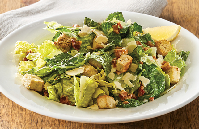 Classic Caesar salad with romaine, bacon, Parmesan and croutons