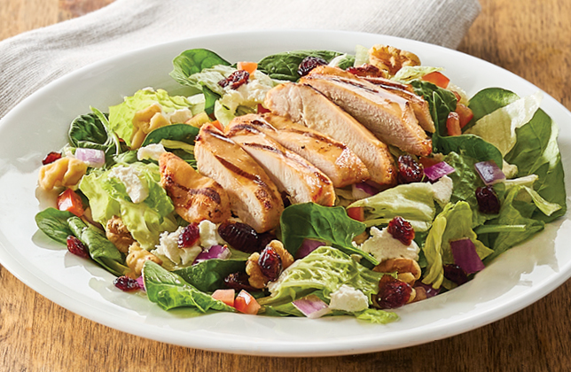 Cranberry and goat cheese salad with grilled chicken, walnuts and red onion